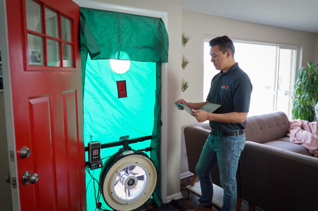Blower door test during an energy audit for Boulder Vacation Rental License