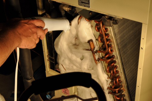 Thawing a frozen evaporator coil in an AC unit