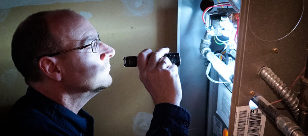 Thinking Of Skipping A Home Inspection? Inspector Inspecting Furnace