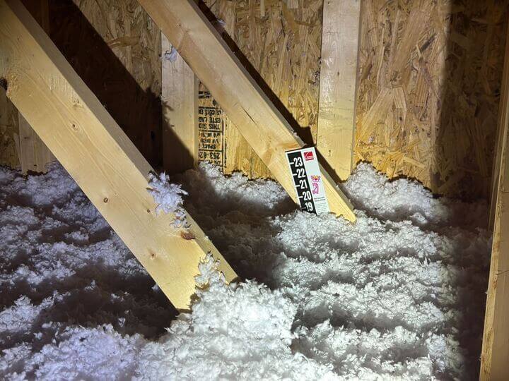 New blown-in insulation recently added to an attic to improve home energy efficiency.