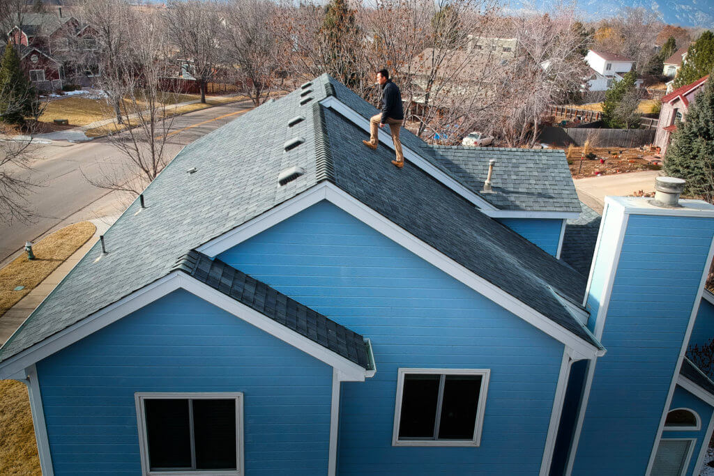 Home inspector viewing a roof. Do home inspectors give repair estimates?