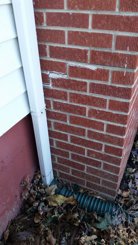 Stair step cracking brick chimney
